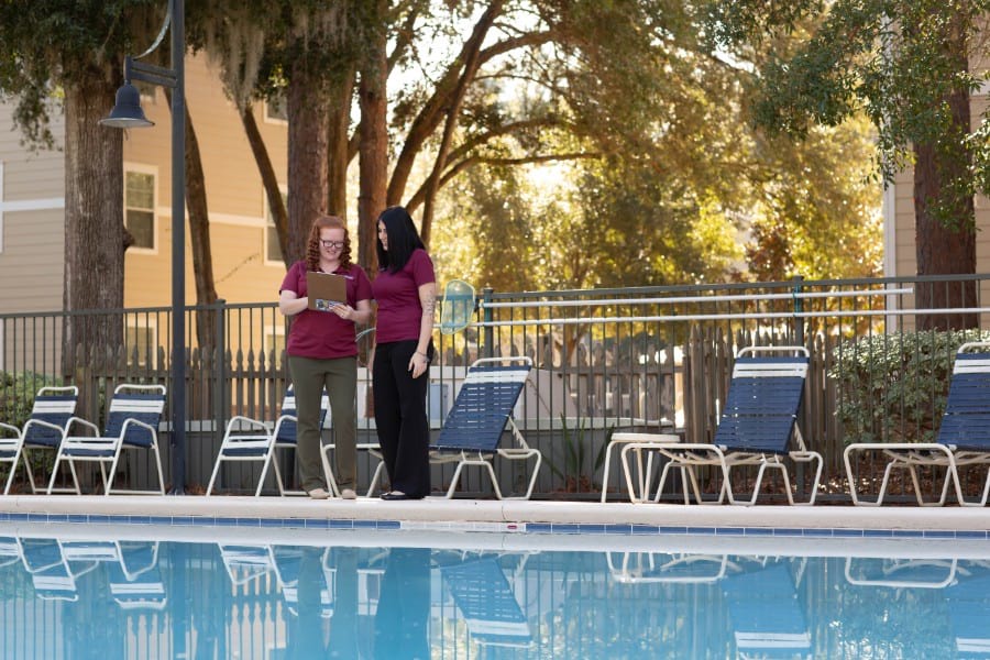 Community managers inspecting pool